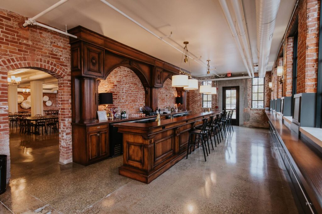 The inside of wedding venue The Hatchery in La Crosse with brick and wood details.